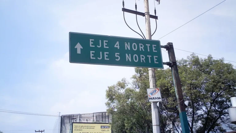 Spanish shop signs on a Latin American city street illustrating english to latin american spanish