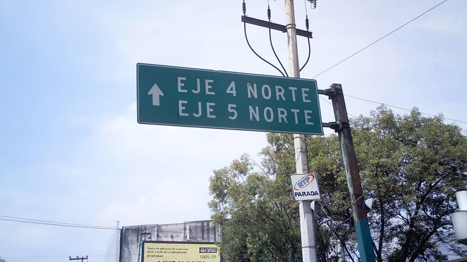 Spanish shop signs on a Latin American city street illustrating english to latin american spanish